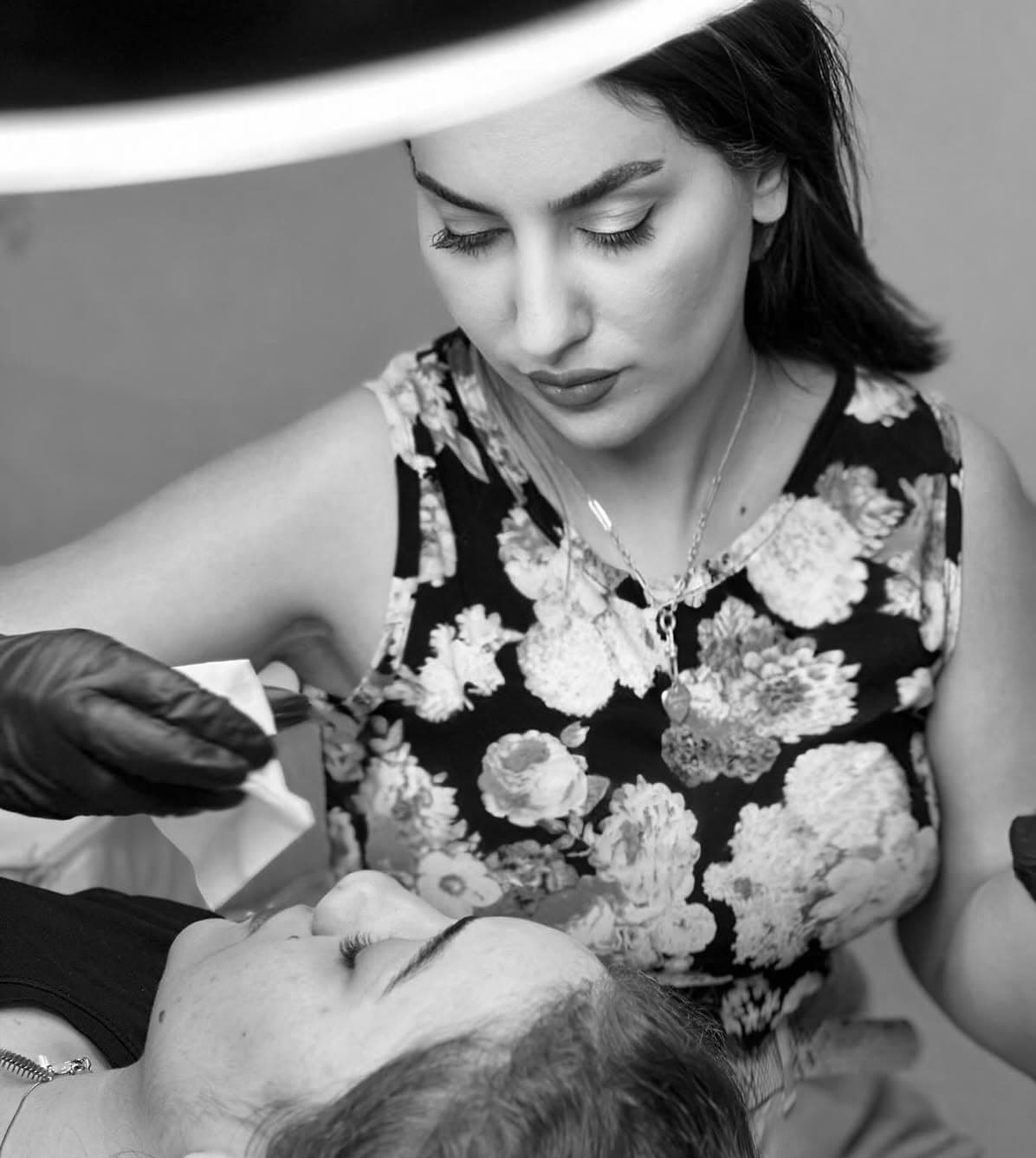 R-Brows Boutique brow artist performing a precision brow treatment